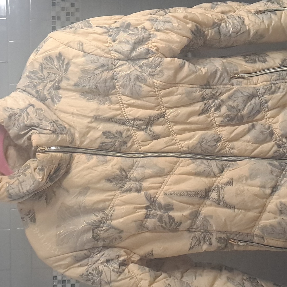 MDC winter jacket. Creme  and grayvcolored with a Parisienne background.